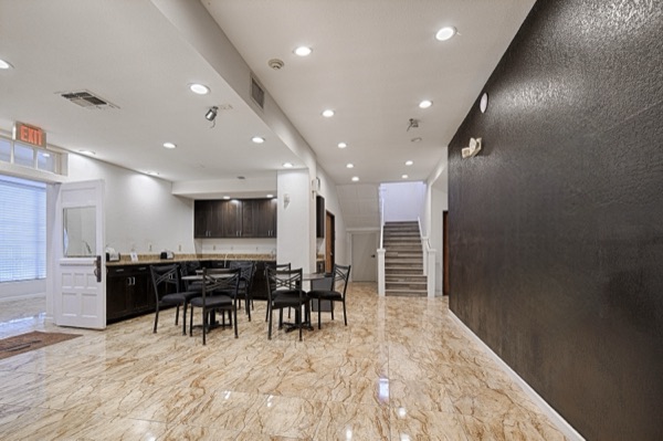 Renovated lobby and guest lounge with polished floors