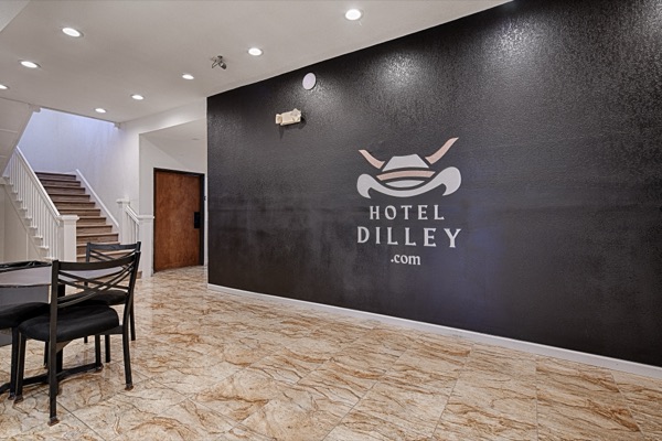Lobby staircase with Hotel Dilley brand wall