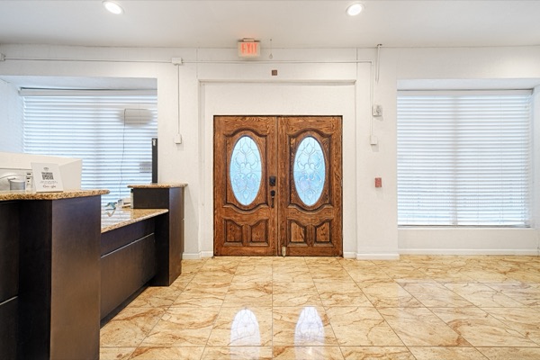 Original ornate double doors at the reception area