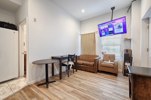 Owner's residence living area with sofa and dining table