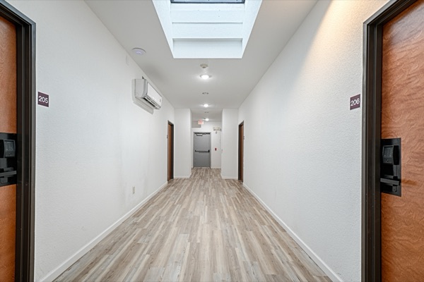Bright second floor corridor with skylight
